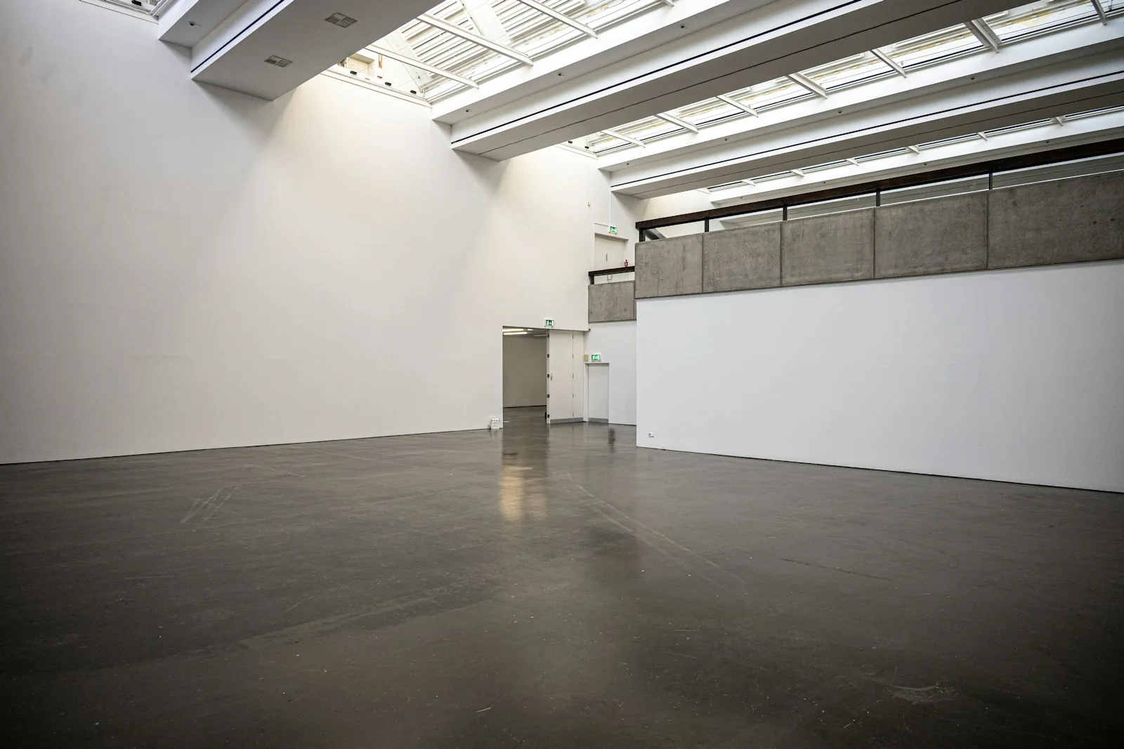 Concrete floor and white walls in a modern gallery interior