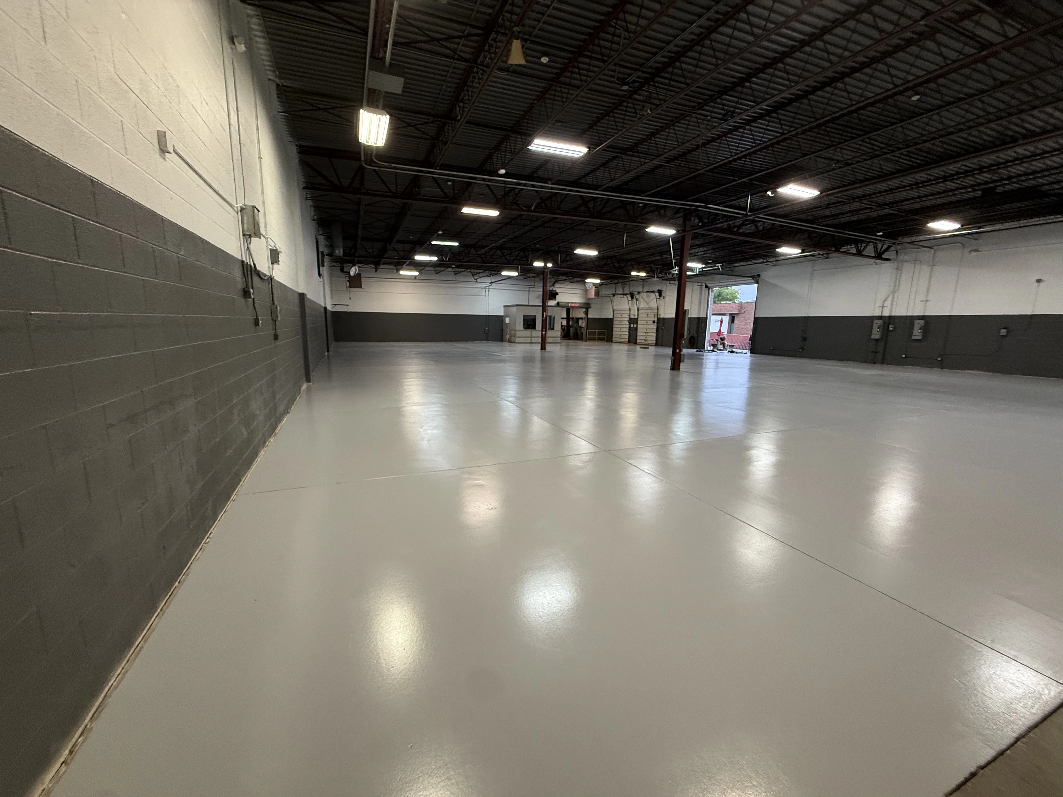 Large industrial warehouse with a finished light-gray floor