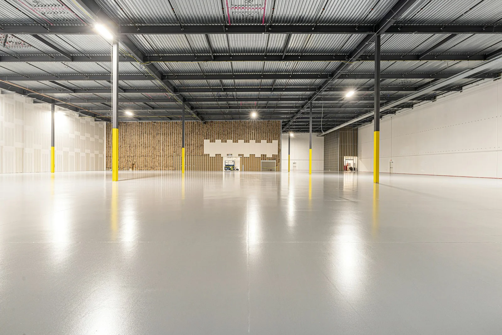 Finished concrete flooring inside an empty industrial space